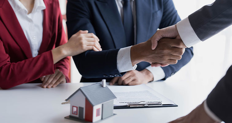 Couple celebrating as first-time homeowners